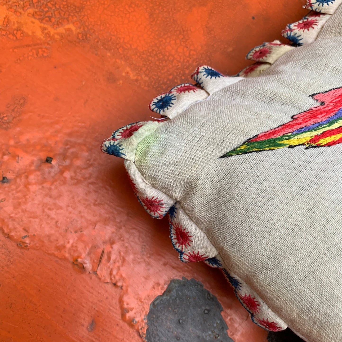 Embroidered pillow with parrot